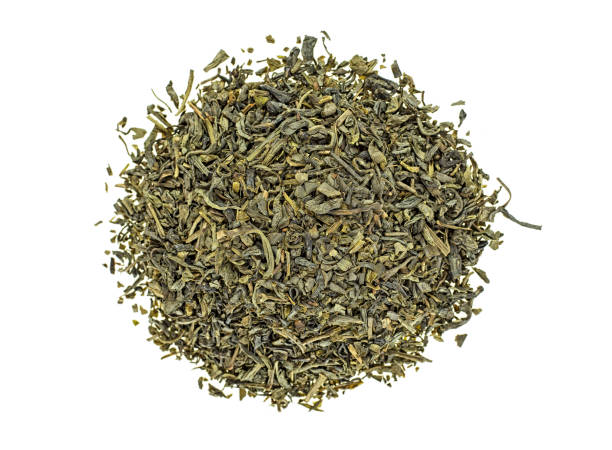 Heap of dry green tea isolated on white background. Top view. Heap of dry green tea isolated on white background. Top view. green tea stock pictures, royalty-free photos & images