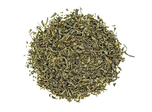 Heap of dry green tea isolated on white background. Top view.