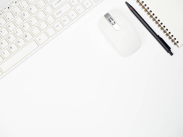 istock Modern white office desk table with keyboard computer and other office supplies of necessity, Top view with copy space 1029959414
