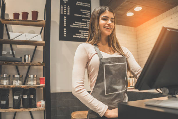 istock The beautiful cafe worker standing behind the cash register 1029962400