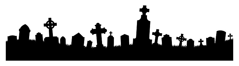 Silhouetted gravestones in a cemetery.