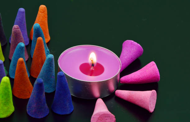 colorful incense or frankincense with candle (soft focus,lens blur)