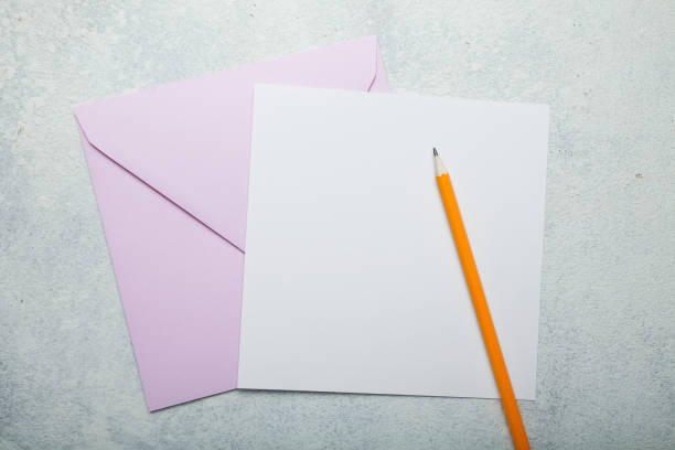 istock Pink square envelope and blank greeting card on vintage white background 1029974762