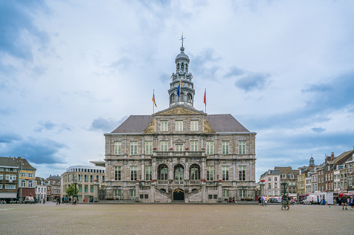 Maastricht, The Netherlands - June 17th 2018, Tourist and locals wander around the historic town hall in the center of town