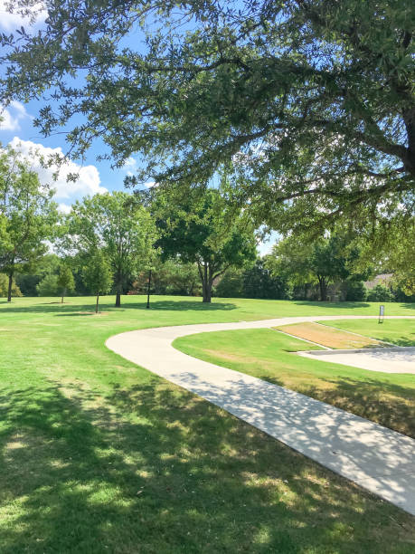 istock Beautiful green park with pathway trail in Coppell, Texas, USA 1029993790