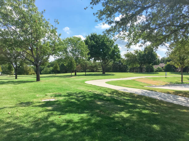istock Beautiful green park with pathway trail in Coppell, Texas, USA 1029993848