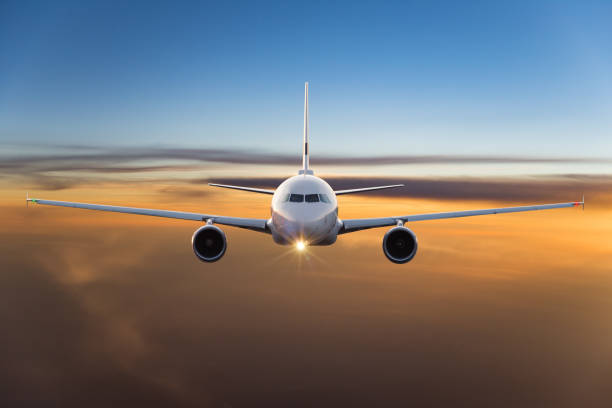 istock Commercial airplane flying above dramatic clouds 1029998826