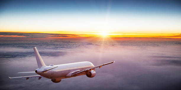 istock Commercial airplane flying above dramatic clouds 1029998856
