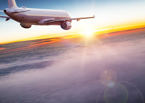 istock Commercial airplane flying above dramatic clouds 1029998866