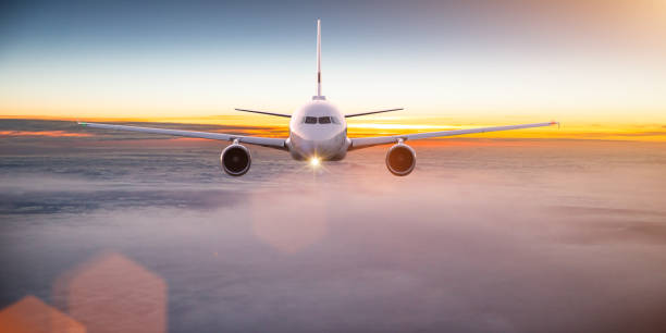 istock Commercial airplane flying above dramatic clouds 1029998880