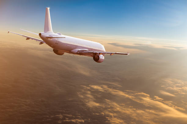 istock Commercial airplane flying above dramatic clouds 1029998938