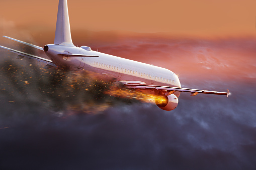 Commercial airplane with engine on fire, concept of aerial disaster.