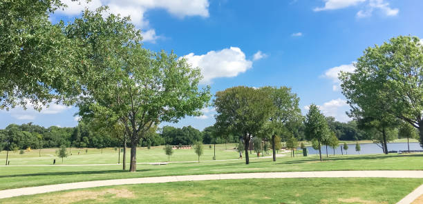 istock Panoramic beautiful green park with pathway trail in Coppell, Texas, USA 1029999112