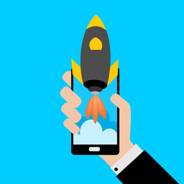 istock Businessman holding a smartphone with a rocket.Concept of Start up. 1030007210