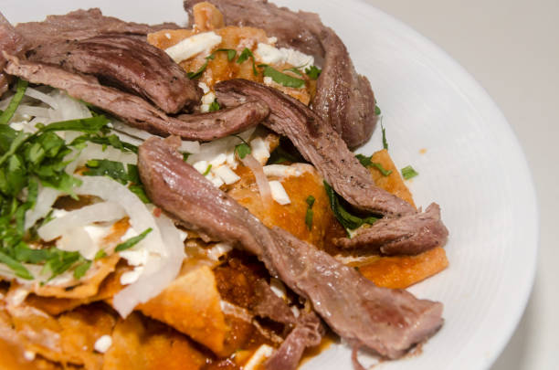 istock Mexican red chilaquiles with arrachera 1030011932