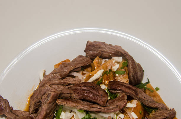istock Mexican red chilaquiles with arrachera 1030012442