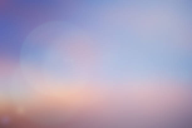 istock blurred beautiful natural pastel background lens ray flare flash light. 1030013308