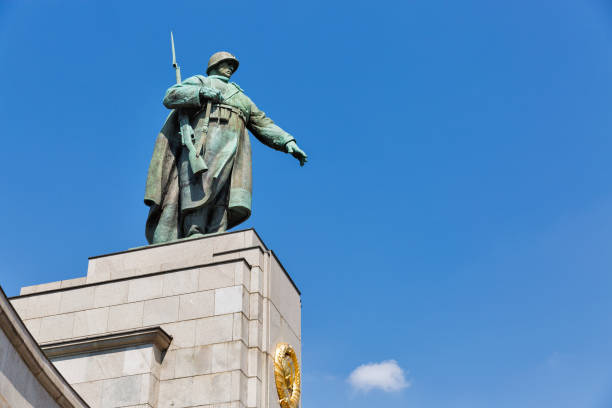 istock Statue of Soviet Soldier at War Memorial in Berlin. 1030015704