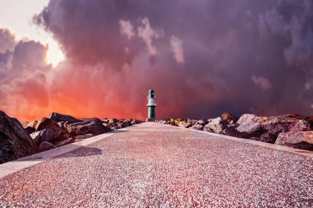 Scenic view of Tallinn Bay from Paljassaare peninsula with red navigation marker, choppy Baltic Sea waves and TV Tower background.High quality photo