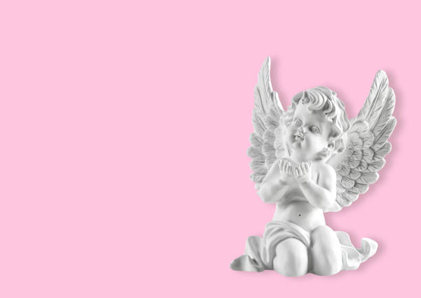 Little white guardian angel pink background Little white guardian angel on pink background winged cherub stock pictures, royalty-free photos & images