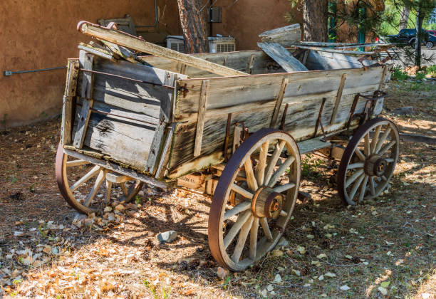 Taos, NM, USA-6 July 18: An old farm wagon sets outside the Red Arrow Emporium on the Overland Sheepskin Ranch in El Prado, Taos, NM.