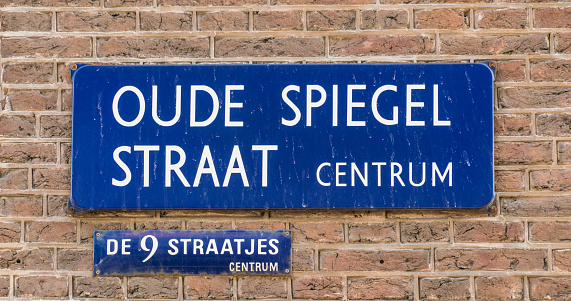 Street name sign 'Oude Spiegel straat Centrum' one of the famous 9 streets in the center of Amsterdam