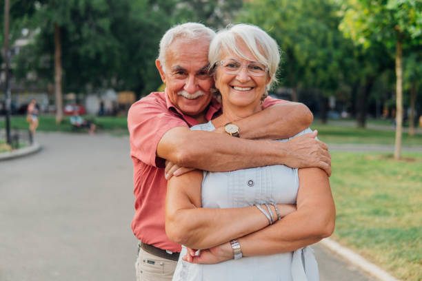istock Senior couple drinking wine on a picnic and smiling 1030030206