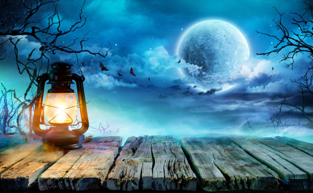 istock Halloween Lantern On Old Table In Spooky Night 1030034596