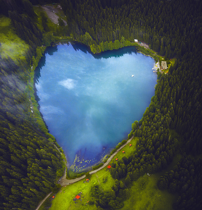 Aerial view of beautiful natural heart-shaped lake Karagol (Black lake) and forest in Savsat, Artvin, Turkey from bird eye view