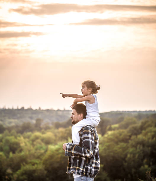 istock father and daughter at sunset, family values 1030035036