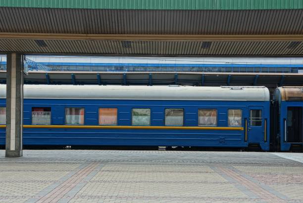 istock blue passenger car with windows stands at the railway station 1030039672