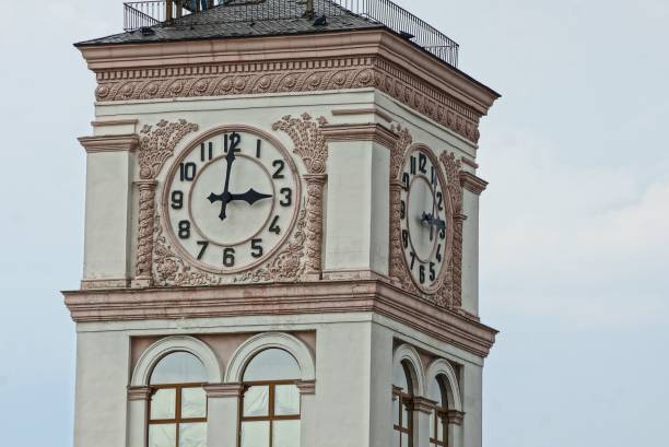 istock part of a tower with a pattern and a large clock on a sky background 1030039730