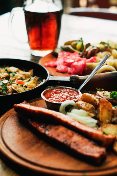 istock Satisfying rustic grilled food with cold beer 1030040052