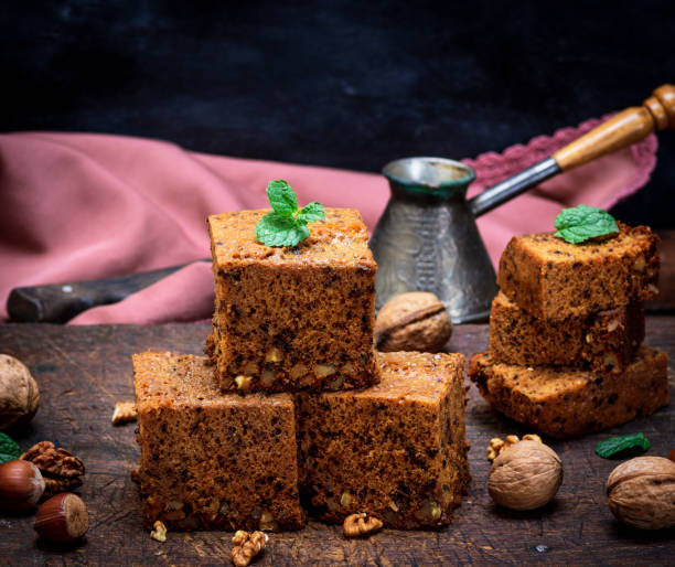 istock baked square slices of pie with walnuts 1030057816