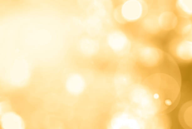 istock Summer blurred nature background view looking up through tree leaves against sky facing sun flare and bokeh 1030071696