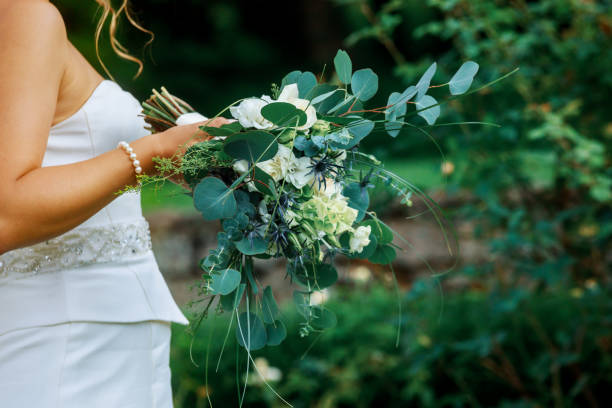istock Wedding bouquet in bride holding her bouquet 1030079990