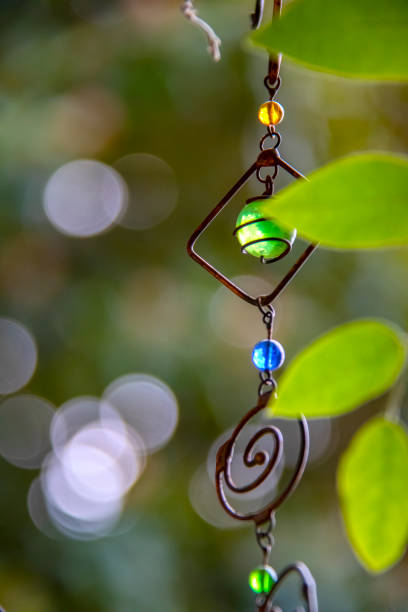 Boho hanging mobile art - wire art -  with bokeh leaves and background