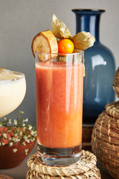 istock Fresh Homemade Fruit Smoothie with Banana, Physalis, Raspberry, Mango and Strawberry 1030110278