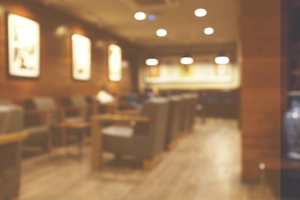 istock Blur cafe restaurant on indoor, use for background. modern cafe with tables, chairs, . For create montage product display in golden time 1030117480