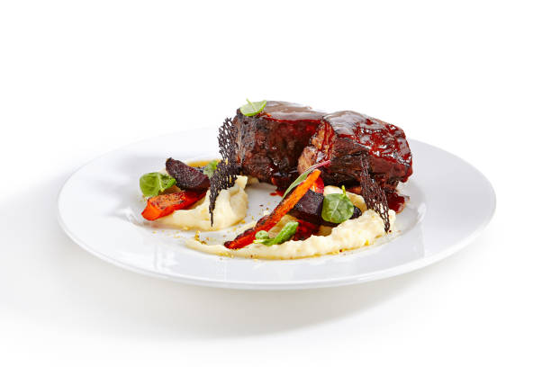 istock Veal Cheeks and Baked Seasonal Vegetables 1030122330
