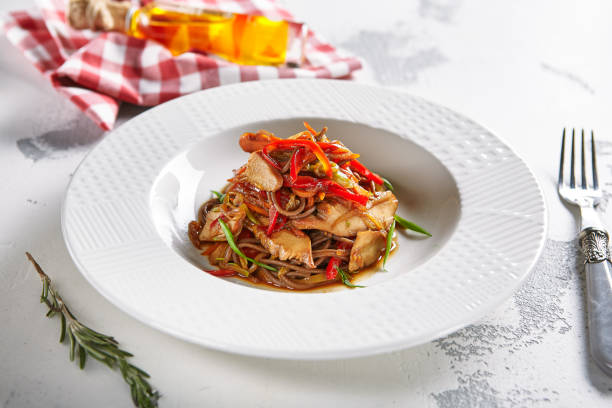 istock Asian Style Soba with Chicken and Vegetables Close Up 1030122394