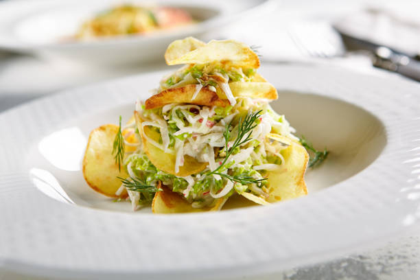 istock Salad with Crispy Potato Chips and Chopped Strips Vegetables 1030122548