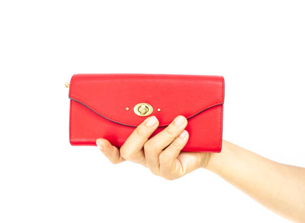 istock red leather wallet in female hand 1030127916