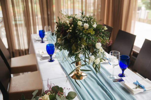 istock Decorated table for wedding celebration. Bright restaurand with a lot of windows 1030148188