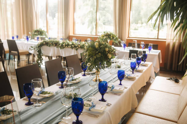 istock Decorated table for wedding celebration. Bright restaurand with a lot of windows 1030148506