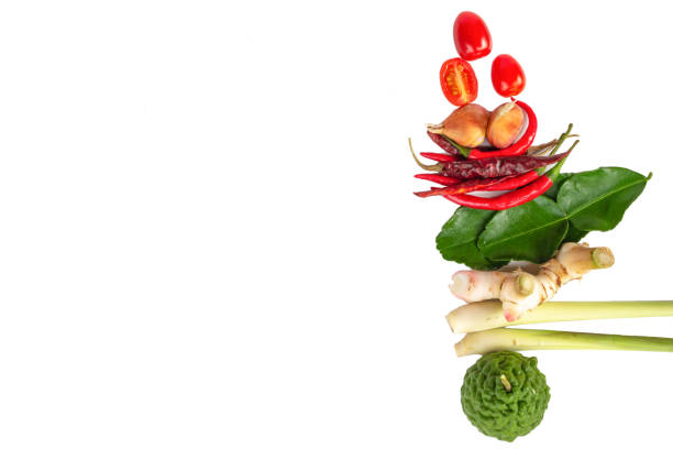 Ingredients (Tom-yum) include lemongrass, kaffir lime, tomato,chilli pepper,galangal on white background.