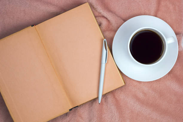 istock coffee and vintage book 1030178276