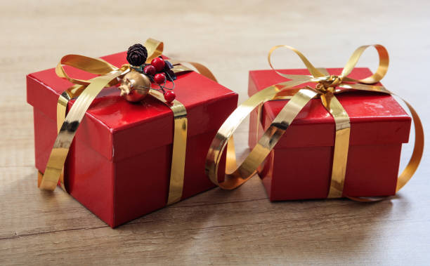 istock Gift boxes on wooden background 1030178348