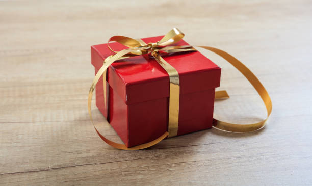 istock Gift box on wooden background 1030178356
