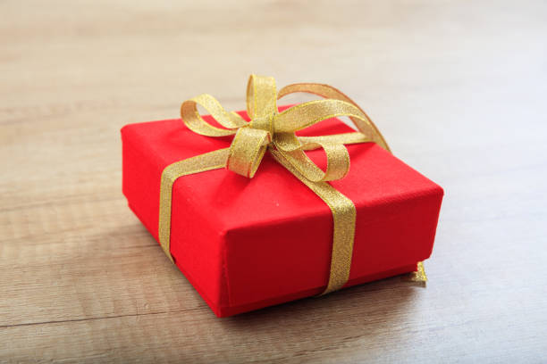 istock Gift box on wooden background 1030178370